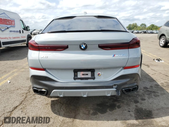 2025 BMW X6 M60i with VIN 5UX43EX06S9W68023, listed as a Copart auction lot 69874764 with 3,789 mi miles and Salvage Title. Bid and sale history available at carsss.com. Image 6.