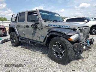 2022 Jeep Wrangler Unlimited Rubicon with VIN 1C4JJXR69NW206276, listed as a Copart auction lot 55247595 with 39,273 mi miles and Salvage title. Bid and sale history available at DreamBid. Image 4.