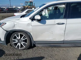 2021 Honda Pilot Touring 8-Passenger with VIN 5FNYF6H92MB031782, listed as a IAAI auction lot 42087322 with 70,062 mi miles and . Bid and sale history available at DreamBid. Image 6.