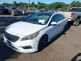 2015 Hyundai Sonata 2.0T Sport with VIN 5NPE34AB5FH166644, listed as a IAAI auction lot 40066764 with 113,887 mi miles. Bid and sale history available at carsss.com. Image 2.