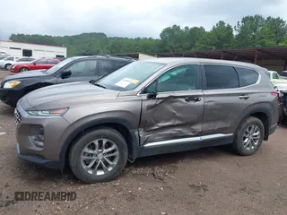 2020 Hyundai Santa Fe SE with VIN 5NMS23AD4LH142202, listed as a IAAI auction lot 42526020 with 59,964 mi miles and . Bid and sale history available at DreamBid. Image 6.