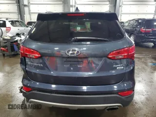 2014 Hyundai Santa Fe z VIN 5XYZUDLB0EG200376, wystawiony jako Copart lot #53634165 z przebiegiem 64 561 mil mil oraz Szkoda całkowita • Salvage title. Historia ofert i sprzedaży dostępna na DreamBid. Obrazek 6.