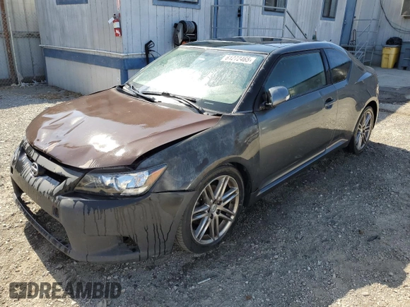 2012 Scion tC z VIN JTKJF5C70C3034928, wystawiony jako Copart lot #61272465 z przebiegiem 183 054 mil mil oraz Szkoda całkowita • Salvage title. Historia ofert i sprzedaży dostępna na DreamBid. Obrazek 1.