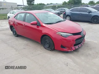 2018 Toyota Corolla L z VIN 5YFBURHE8JP750738, wystawiony jako IAAI lot #42293981 z przebiegiem 128 710 mil mil oraz . Historia ofert i sprzedaży dostępna na DreamBid. Obrazek 1.