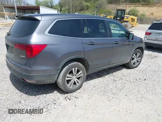 2018 Honda Pilot EX-L with VIN 5FNYF6H52JB066721, listed as a IAAI auction lot 42052842 with 134,393 mi miles and . Bid and sale history available at DreamBid. Image 4.