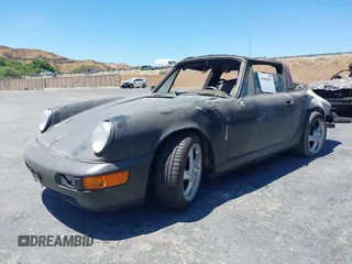 1988 Porsche 911 z VIN WP0EB0917JS161351, wystawiony jako IAAI lot #39908257 z przebiegiem Nie podano mil oraz . Historia ofert i sprzedaży dostępna na DreamBid. Obrazek 2.