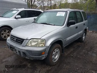 2001 Honda CR-V LX with VIN JHLRD28441C000682, listed as a IAAI auction lot 42019317 with 214,884 mi miles. Bid and sale history available at carsss.com. Image 2.