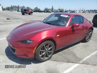2019 Mazda MX-5 Miata Grand Touring with VIN JM1NDAM73K0302201, listed as a Copart auction lot 60565665 with 27,701 mi miles and Salvage title. Bid and sale history available at DreamBid. Image 1.