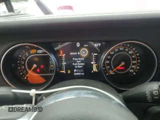 2022 Jeep Wrangler Unlimited Sahara with VIN 1C4HJXEN0NW106045, listed as a Copart auction lot 52383455 with 104,937 mi miles and Salvage title. Bid and sale history available at DreamBid. Image 9.