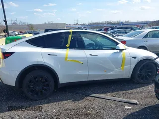 2023 Tesla Model Y Long Range with VIN 7SAYGDEE4PF780951, listed as a IAAI auction lot 41856461 with 63,317 mi miles. Bid and sale history available at carsss.com. Image 13.