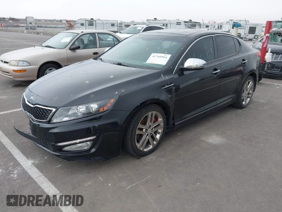 2013 Kia Optima SX with VIN 5XXGR4A63DG141938, listed as a IAAI auction lot 41760964 with 77,241 mi miles and . Bid and sale history available at DreamBid. Image 2.