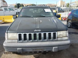 1995 Jeep Grand Cherokee Laredo z VIN 1J4GZ58S9SC553345, wystawiony jako IAAI lot #42772979 z przebiegiem 216 808 mil mil oraz . Historia ofert i sprzedaży dostępna na DreamBid. Obrazek 6.