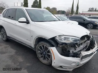 2018 BMW X5 xDrive40e iPerformance with VIN 5UXKT0C58J0V99415, listed as a IAAI auction lot 41391474 with 124,671 mi miles. Bid and sale history available at carsss.com. Image 14.