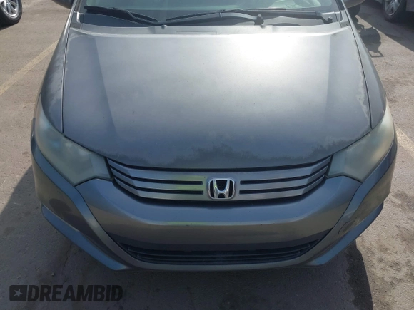 2010 Honda Insight EX with VIN JHMZE2H71AS032532, listed as a IAAI auction lot 41988221 with 333,144 mi miles and . Bid and sale history available at DreamBid. Image 12.