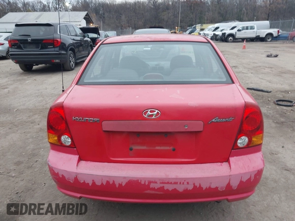 2005 Hyundai Accent GLS with VIN KMHCG45CX5U614083, listed as a IAAI auction lot 41006582 with 72,516 mi miles. Bid and sale history available at carsss.com. Image 16.