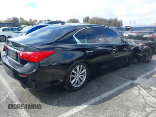 2014 Infiniti Q50 Premium with VIN JN1BV7AR2EM685587, listed as a IAAI auction lot 41777563 with 134,443 mi miles and . Bid and sale history available at DreamBid. Image 4.