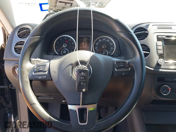 2015 Volkswagen Tiguan SE with VIN WVGAV7AX1FW558855, listed as a IAAI auction lot 42064427 with 58,584 mi miles and . Bid and sale history available at DreamBid. Image 11.