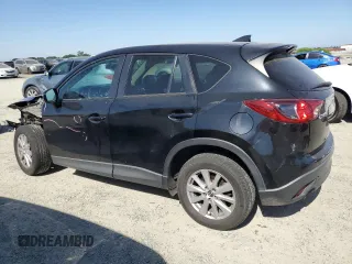 2016 Mazda CX-5 Touring z VIN JM3KE2CY5G0617516, wystawiony jako Copart lot #56421005 z przebiegiem 110 739 mil mil oraz Szkoda całkowita • Salvage title. Historia ofert i sprzedaży dostępna na DreamBid. Obrazek 2.