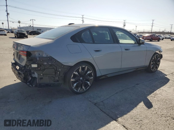 2024 BMW 5 Series 530i with VIN WBA43FJ06RCP67824, listed as a Copart auction lot 61351965 with 12,990 mi miles and Salvage title. Bid and sale history available at DreamBid. Image 3.