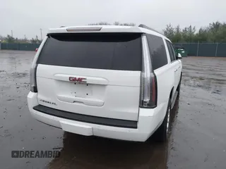 2015 GMC Yukon XL SLT with VIN 1GKS1HKC7FR223513, listed as a IAAI auction lot 40822575 with 128,239 mi miles. Bid and sale history available at carsss.com. Image 4.