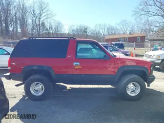 1999 Chevrolet Tahoe with VIN 3GNEK18R7XG189820, listed as a IAAI auction lot 41631906 with 212,720 mi miles. Bid and sale history available at carsss.com. Image 14.