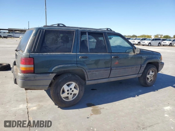 1995 Jeep Grand Cherokee Laredo with VIN 1J4FX58S5SC741328, listed as a Copart auction lot 82034594 with 260,398 mi miles and Clean Title. Bid and sale history available at carsss.com. Image 3.