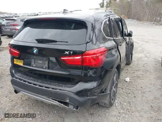 2018 BMW X1 xDrive28i with VIN WBXHT3C34J5K21576, listed as a IAAI auction lot 41822390 with 69,645 mi miles. Bid and sale history available at carsss.com. Image 4.