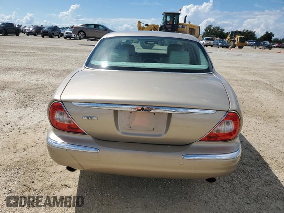 2004 Jaguar XJ with VIN SAJWA71C24SG28164, listed as a Copart auction lot 73968134 with 0 mi miles and Salvage Title. Bid and sale history available at carsss.com. Image 6.