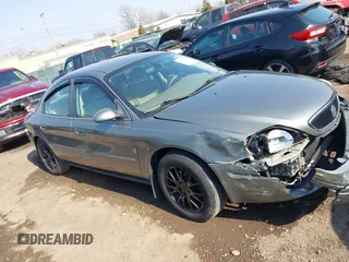 2003 Mercury Sable GS z VIN 1MEFM50243A619761, wystawiony jako IAAI lot #41790150 z przebiegiem 114 522 mil mil oraz . Historia ofert i sprzedaży dostępna na DreamBid. Obrazek 13.