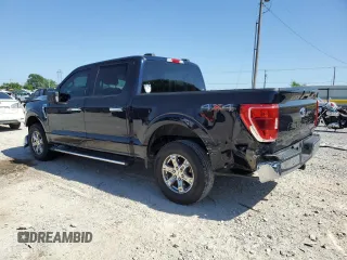 2021 Ford F-150 XL with VIN 1FTFW1E5XMFA47980, listed as a Copart auction lot 56737215 with 63,781 mi miles and Salvage title. Bid and sale history available at DreamBid. Image 2.