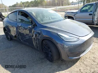 2022 Tesla Model Y Long Range z VIN 7SAYGDEE7NA006476, wystawiony jako IAAI lot #41894606 z przebiegiem 63 380 mil mil oraz . Historia ofert i sprzedaży dostępna na DreamBid. Obrazek 1.
