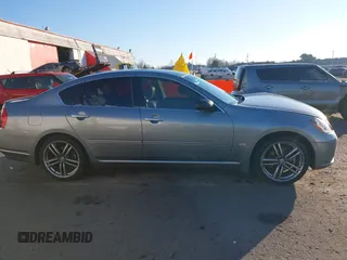 2006 Infiniti M z VIN JNKAY01E56M107083, wystawiony jako IAAI lot #41443347 z przebiegiem 162 191 mil mil oraz . Historia ofert i sprzedaży dostępna na DreamBid. Obrazek 13.