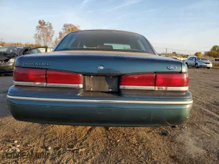 1996 Ford Crown Victoria LX with VIN 2FALP74W5TX146843, listed as a Copart auction lot 77251964 with 74,559 mi miles and Clean Title. Bid and sale history available at carsss.com. Image 6.