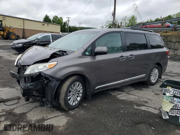 2015 Toyota Sienna XLE with VIN 5TDYK3DC4FS659692, listed as a Copart auction lot 57248355 with 121,644 mi miles and Salvage title. Bid and sale history available at DreamBid. Image 1.