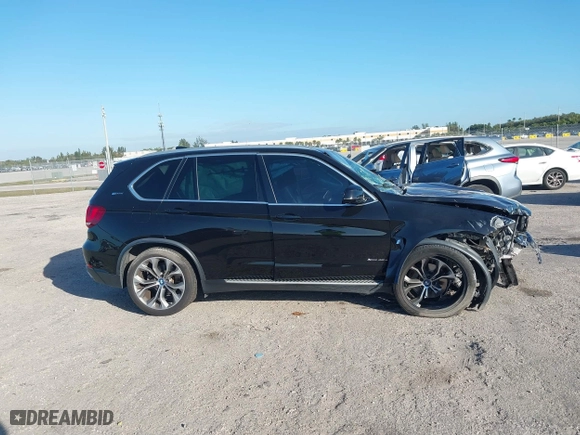 2018 BMW X5 xDrive40e iPerformance with VIN 5UXKT0C59J0W00801, listed as a IAAI auction lot 41081133 with 63,265 mi miles. Bid and sale history available at carsss.com. Image 14.