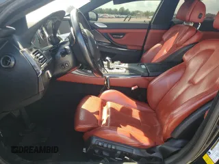 2015 BMW M6 z VIN WBS6C9C50FD467779, wystawiony jako Copart lot #56702794 z przebiegiem 78 259 mil mil oraz Szkody całkowita. Historia ofert i sprzedaży dostępna na DreamBid. Obrazek 7.