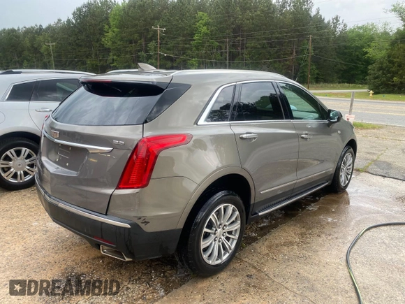 2019 Cadillac XT5 Luxury FWD with VIN 1GYKNCRS0KZ206086, listed as a Copart auction lot 54454825 with 93,621 mi miles and Salvage Title. Bid and sale history available at DreamBid. Image 4.