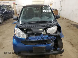 2009 Smart fortwo Pure z VIN WMEEJ31X99K209790, wystawiony jako Copart lot #51102685 z przebiegiem 30 389 mil mil oraz Szkody całkowita. Historia ofert i sprzedaży dostępna na DreamBid. Obrazek 5.
