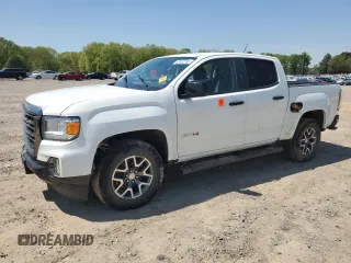 2021 GMC Canyon 4WD AT4 z VIN 1GTG6FEN5M1118081, wystawiony jako Copart lot #52452785 z przebiegiem 92 960 mil mil oraz Szkody całkowita. Historia ofert i sprzedaży dostępna na DreamBid. Obrazek 1.