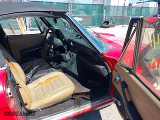 1989 Alfa Romeo Spider Graduate with VIN ZARBA5641K1063527, listed as a IAAI auction lot 41884427 with 107,243 mi miles. Bid and sale history available at carsss.com. Image 5.
