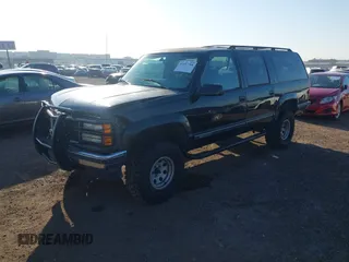 1999 GMC Suburban with VIN 3GKEC16R7XG527908, listed as a IAAI auction lot 41657788 with 216,894 mi miles. Bid and sale history available at carsss.com. Image 2.