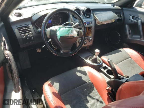 2008 Hyundai Tiburon GT z VIN KMHHN66F18U295838, wystawiony jako Copart lot #51972325 z przebiegiem 147 626 mil mil oraz Szkoda całkowita • Salvage title. Historia ofert i sprzedaży dostępna na DreamBid. Obrazek 8.