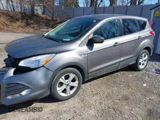 2014 Ford Escape SE z VIN 1FMCU0G99EUB25967, wystawiony jako IAAI lot #41805970 z przebiegiem 72 770 mil mil oraz . Historia ofert i sprzedaży dostępna na DreamBid. Obrazek 2.