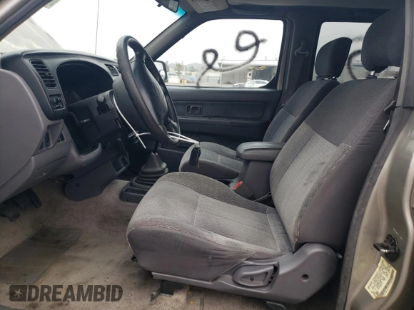 2000 Nissan Frontier XE with VIN 1N6ED27T8YC357939, listed as a Copart auction lot 55727395 with 143,842 mi miles and Salvage title. Bid and sale history available at DreamBid. Image 7.
