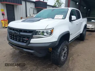 2019 Chevrolet Colorado 4WD ZR2 z VIN 1GCPTEE13K1166594, wystawiony jako IAAI lot #42374128 z przebiegiem 127 889 mil mil oraz . Historia ofert i sprzedaży dostępna na DreamBid. Obrazek 2.