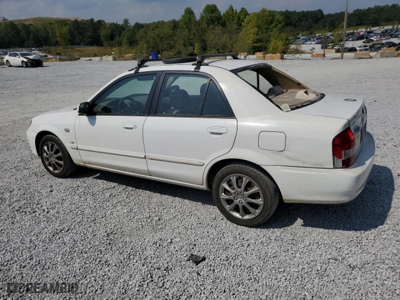 2002 Mazda Protege DX with VIN JM1BJ225X21597889, listed as a Copart auction lot 72237874 with 254,402 mi miles and Salvage Title. Bid and sale history available at carsss.com. Image 2.