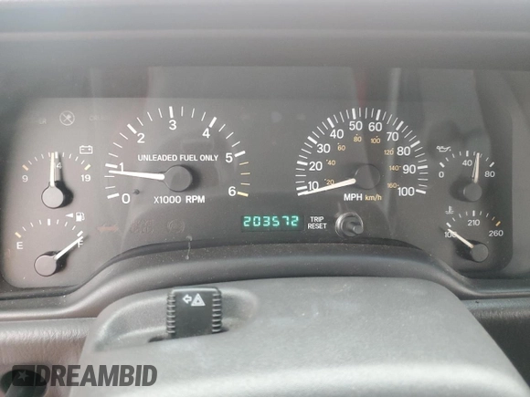 1999 Jeep Cherokee Sport with VIN 1J4FT68S1XL601799, listed as a Copart auction lot 83881844 with 203,572 mi miles and Salvage title. Bid and sale history available at DreamBid. Image 9.