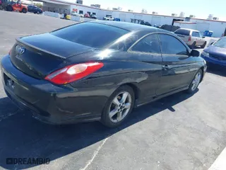 2004 Toyota Camry Solara SE with VIN 4T1CA38P24U015266, listed as a IAAI auction lot 41976105 with 221,942 mi miles. Bid and sale history available at carsss.com. Image 4.