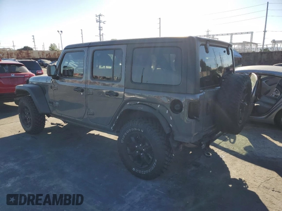 2020 Jeep Wrangler Unlimited Willys with VIN 1C4HJXDG5LW348507, listed as a Copart auction lot 77000574 with 57,056 mi miles and Salvage title. Bid and sale history available at DreamBid. Image 2.
