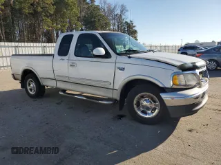 2000 Ford F-150 XL with VIN 1FTRX17L1YNA26050, listed as a Copart auction lot 43597105 with 205,152 mi miles and Salvage Title. Bid and sale history available at carsss.com. Image 4.